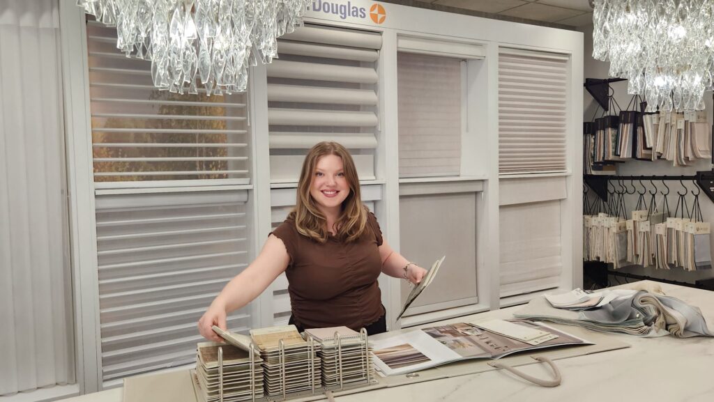 A Superblinds designer with samples ready to help clients in the showroom.